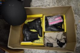 Horse riding equipment to include a helmet and boots.