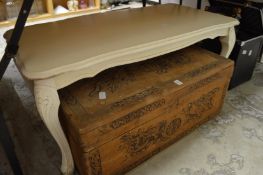 Chinese camphor wood trunk and a painted coffee table.