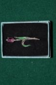 A silver, enamel and marcasite brooch in the form of a tulip.