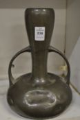 An Art Nouveau pewter twin handled vase.