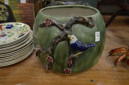 Pottery jardiniere mounted decorated with a bird on a branch.