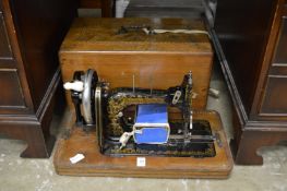 Walnut cased sewing machine.