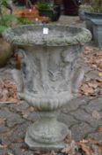 A reconstituted stone twin handled classical style garden urn.
