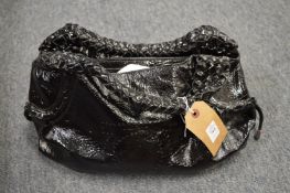 A Salvatore Ferragano patent black leather handbag.