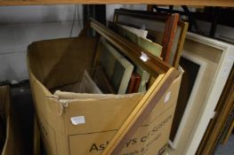Various paintings, prints and a picture frame.