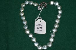 A decorative pearl necklace.