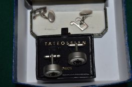 Two pairs of cufflinks.