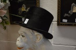 A black silk top hat, 7¾