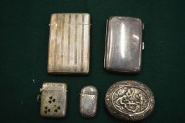 Silver cigarette cases and other items.