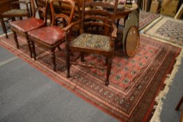 A modern Bokhara style carpet, 300cm x 210cm.