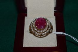 A yellow metal and gem set ring.