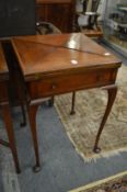 An Edwardian mahogany envelope card table.