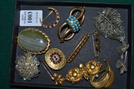 A collection of brooches.