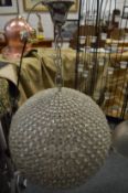 A large globe style crystal chandelier.