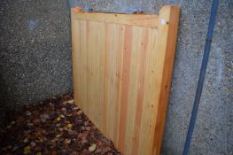 A pair of unused pine driveway gates with fittings combined size 3.6m x 1.5m.