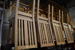 A set of eight oak high back dining chairs.