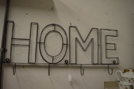 A novelty coat rack 'home'.