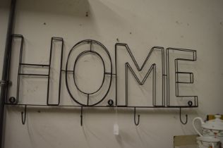 A novelty coat rack 'home'.