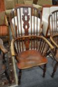 A 19th century ash and elm Windsor armchair.