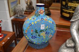 A pair of Chinese polychrome decorated moon flasks.