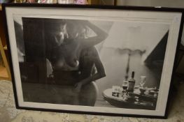 A large erotic photographic print.