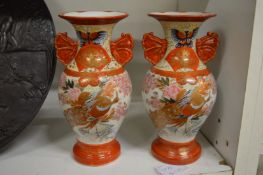 A pair of small Kutani vases.