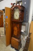 A 19th century mahogany longcase clock with painted arched dial and eight day movement.