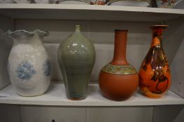 Two studio pottery vases and two other vases.