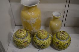A set of three Chinese famille jaune ginger jars together with two Chinese yellow ground vases.