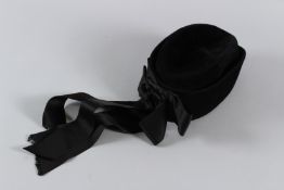A VINTAGE BLACK CHANEL JEWISH HAT with ribbon.