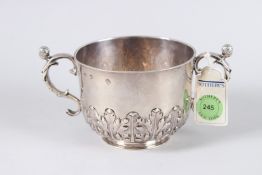 A SUPERB CHARLES II SILVER TWO HANDLED PORRINGER with female masks on the handles. London 1674.