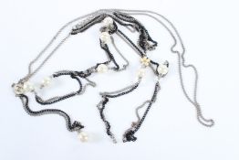 A VINTAGE CHANEL NECKLACE set with eight pearls and enamel double C.