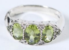 A SILVER PERIDOT AND DIAMOND RING.