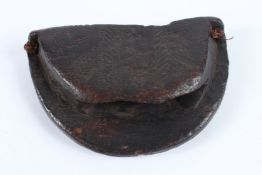 AN EARLY NAIVE CARVED WOOD POUCH. 18cms high.