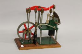 A MODEL OF A HOT AIR ENGINE made by Richard Mitchell, Engineer, Selsey. 39cms x 42cms.