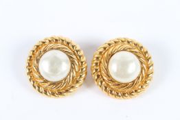 A GOOD PAIR OF CHANEL CIRCULAR GILT METAL AND PEARL EAR CLIPS. 3cms diameter.