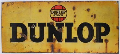 A LARGE VINTAGE DUNLOP STOCK ENAMEL SIGN. 60cms x 3m 6cms.