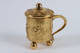 A SUPERB RUSSIAN SILVER GILT TANKARD AND COVER. Repousse with geometric designs and flowers on three