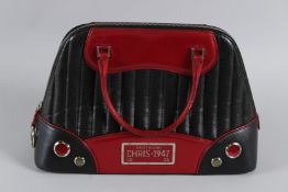 A CHRISTIAN DIOR RED LEATHER MONTAIGNE CHRIS 1947 BAG BN-0061. 38cms long, with dust cover. Sold