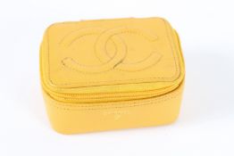 A SMALL CHANEL LEATHER MAKE UP CASE with mirror. 10cms.