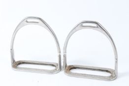A PAIR OF CHROME STIRRUPS.