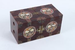 A CHINESE LACQUER FOLDING JEWELLERY BOX with mother-of-pearl fish. 23cms wide.