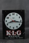 A SMITHS K.L.G. PLUGS CLOCK. 36cms x 26cms.