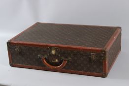 A LOUIS VUITTON SUITCASE No. 40809. 65cms long x 45cms wide x 17cms deep.