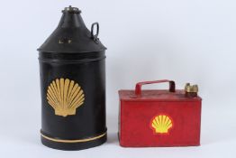A BLACK SHELL CIRCULAR OIL CAN 43cms high and a small red Shell can 15cms high (2).