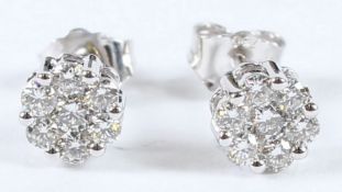 A PAIR OF 18CT DIAMOND CLUSTER EAR STUDS. 0.70 carat.