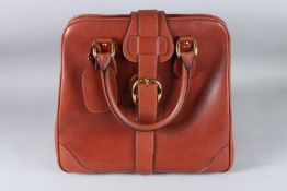 A LARGE GUCCI BROWN LEATHER HANDBAG. 36cms high.