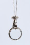 A SILVER RUBY SET HAND MAGNIFYING GLASS with silver chain.