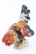 AN ALGORA PORCELAIN COCKEREL. 33cms high.