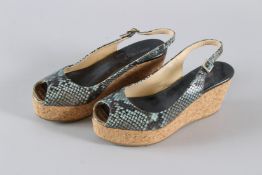A PAIR OF JIMMY CHOO SNAKESKIN SHOES. Size 38.5, with dust bag.